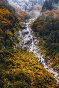 Ayder Plateau Natural Gelintulu Waterfall surrounded by autumn colors near Rize, Turkey.