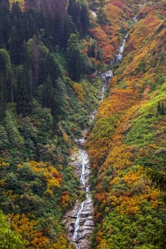 Ayder Plateau Natural Gelintulu Waterfall surrounded by autumn colors near Rize, Turkey.