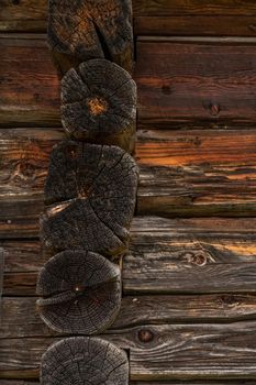 Wooden log cabin or felling  Rustic texture or background. Aged wood wall and boards