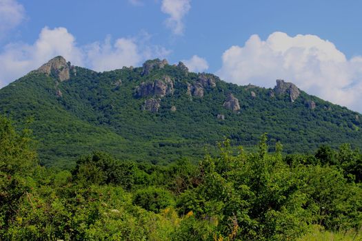 Mountain landscape, road to the mountains. Travel in the mountains.