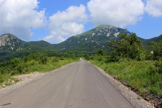 Mountain landscape, road to the mountains. Travel in the mountains.