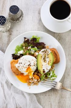 A healthy and balanced breakfast plate.
Benedict's egg spreads on a toasted toast with half an avocado, quinoa and lettuce, seasoned   spices and yogurt dressing. Enjoy the most important meal of the day
