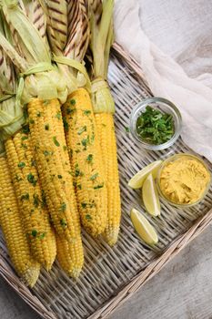 Tender, juicy grilled corn on the cob, seasoned butter with spicy curry and cilantro, grilled