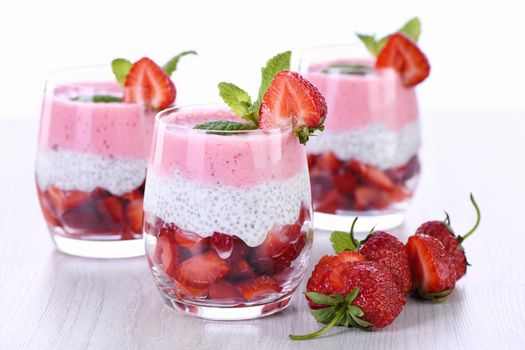 Strawberry dessert with milk vanilla chia and fresh strawberry pieces