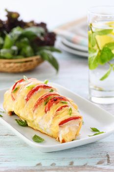 Chicken caprese. Tender chicken breast baked with slices of tomato and cheese.