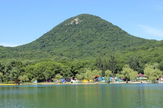 Decorative lake in the park near the mountain.