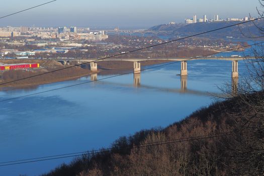 Beautiful landscape. Bridge across the river and urban infrastructure. High quality photo