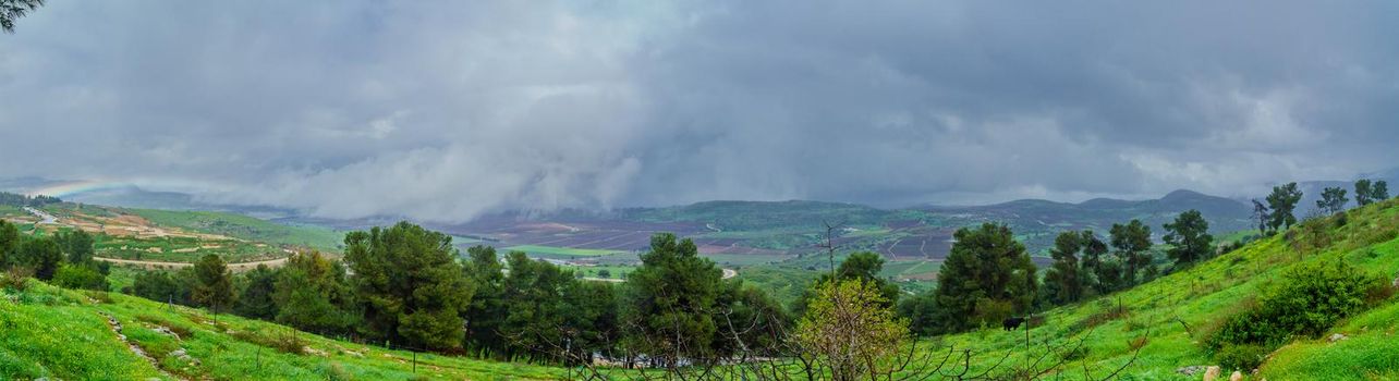 Panoramic view of landscape and countryside along the Kedesh valley, with a rainbow. Upper Galilee, Northern Israel