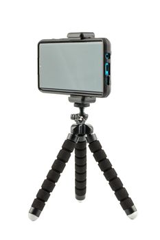 black cellphone in rugged rubber protective cover on small flexible tripod isolated on white background