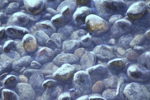 Set of natural stones on the bank of a river. No people