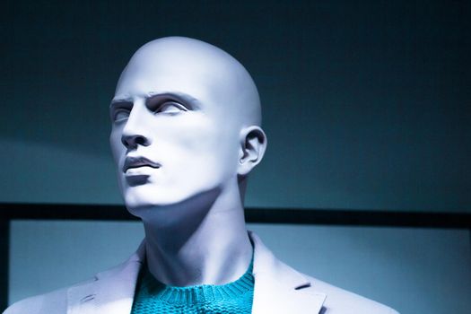 Portrait of a male mannequin with mysterious expression. No people