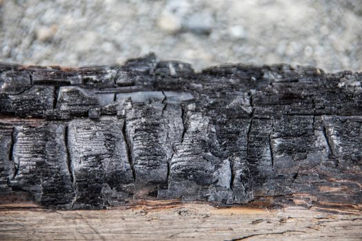 charred beam after house fire
