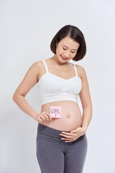 Pregnant woman with stickers over white