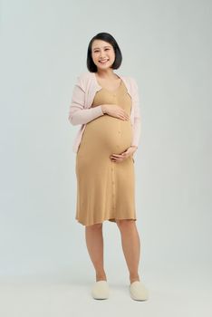 Pregnant woman wearing maternity dress