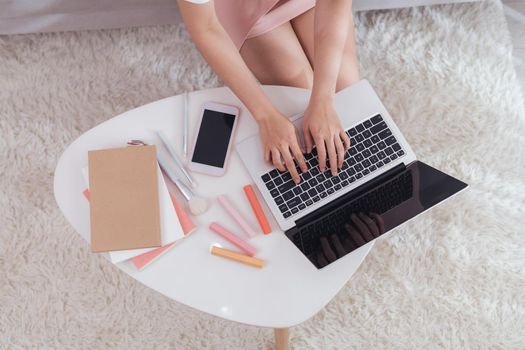 Freelance woman entrepreneur SME seller typing on laptop computer noting the order. Online selling,