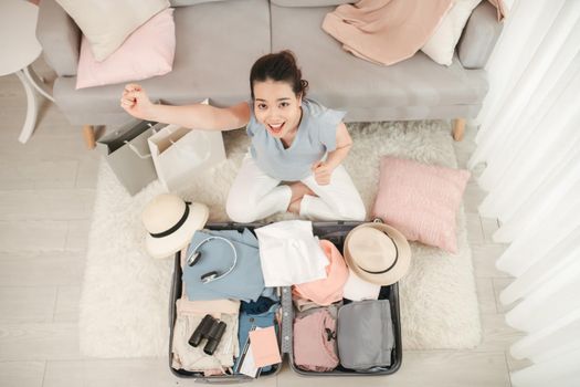 Traveler,people,Tourism and holiday concept.Happy woman ready for travel with suitcase