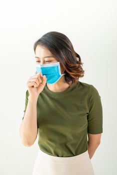Woman wearing mask to avoid virus and feeling sick