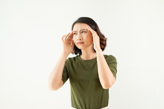woman with a headache on an isolated white background