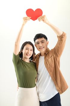 Bright picture of beautiful couple holding big heart