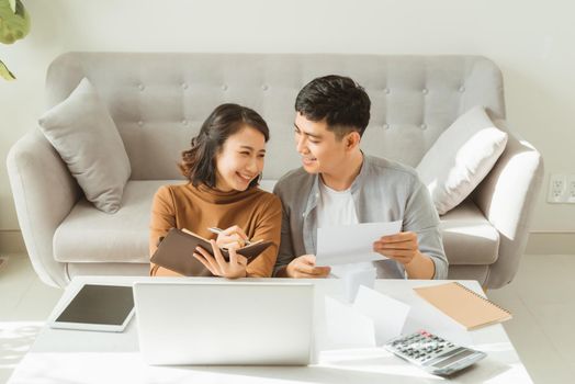 Young Asian man and woman stress with her business online shopping at office.