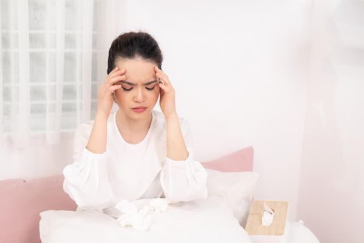 Young ill woman in bed at home