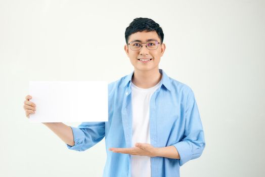Young asian man holding poster