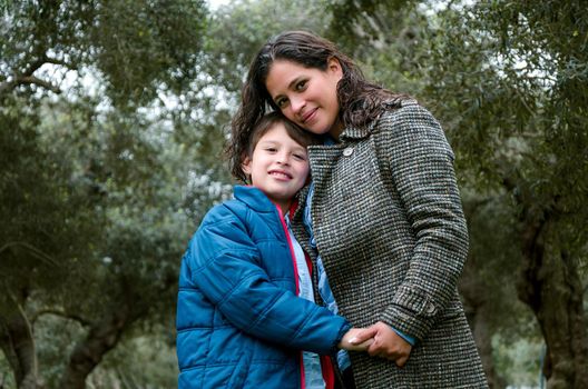 Portrait of a mother with her son teenager. Tenderness, love, multinational family