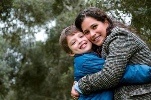 Portrait of a mother with her son teenager. Tenderness, love, multinational family