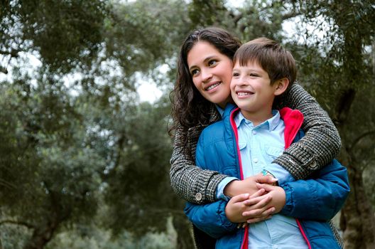 Portrait of a mother with her son teenager. Tenderness, love, multinational family