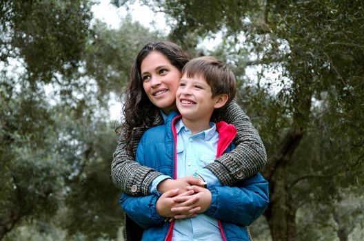 Portrait of a mother with her son teenager. Tenderness, love, multinational family