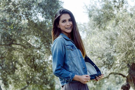 woman autumn portrait. fashion girl outdoor. Autumn woman having fun at the park and smiling. young woman portrait in autumn color