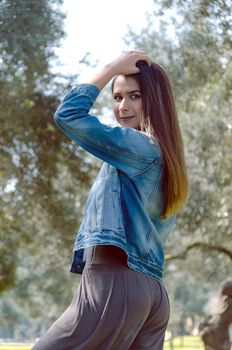 woman autumn portrait. fashion girl outdoor. Autumn woman having fun at the park and smiling. young woman portrait in autumn color