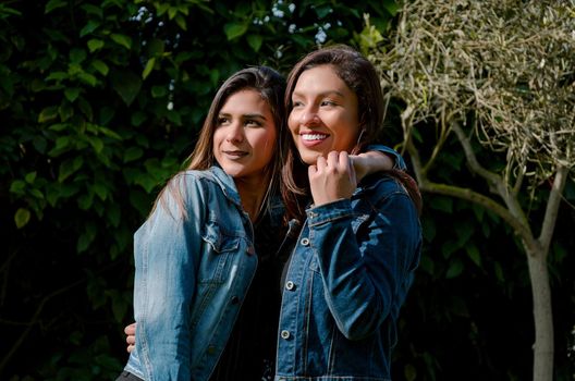 Outdoor lifestyle portrait of two best friends, smiling and having fun together