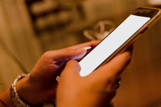 Woman using smartphone. Woman using smartphone white screen. Woman hand holding smartphone.