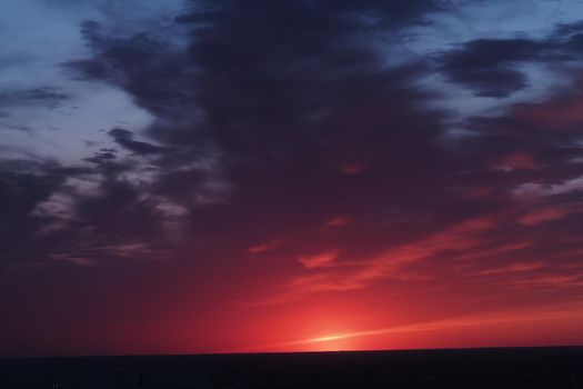 It's a beautiful sunset. horizon. The sky in the evening with clouds and the setting sun. High quality photo