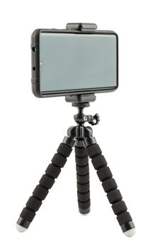 black cellphone in rugged rubber protective cover on small flexible tripod isolated on white background