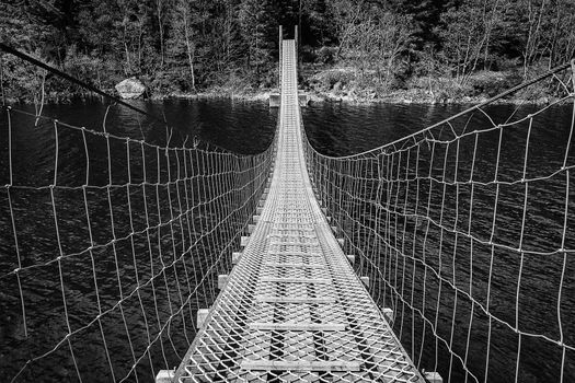 A suspension bridge crossing waters on a popular hiking area in south-west part of Norway.