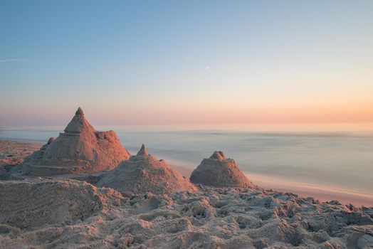 Summer fun at the beach, building sand castles and enjoying the warm summer evening