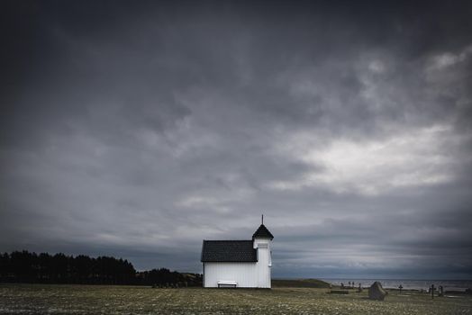 An old church near the coast south of Stavanger, Bryne. This is a small church, used by a small community long time ago. An image to remind us of fallen sailors over the years at sea.