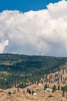 Summer mountains landscape on cloudy sky background in Okanagan valley
