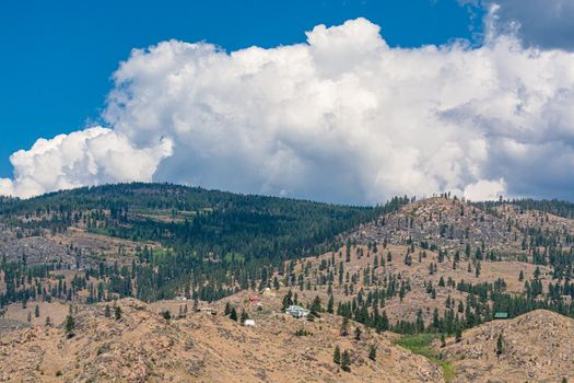 Summer mountains landscape on cloudy sky background in Okanagan valley