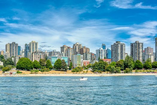 View on old part of Vancouver downtown over Coal harbor. Downtown view with cloudy sky background