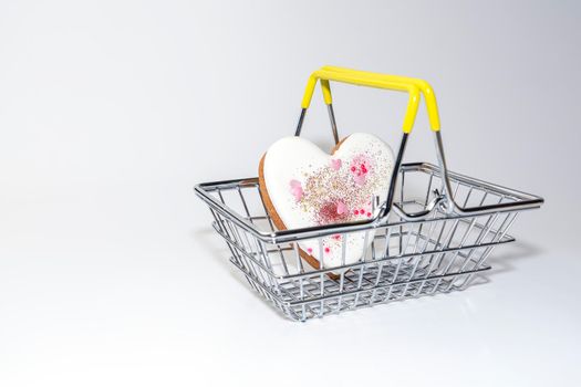 ginger cookies in the form of a heart in a supermarket basket. High quality photo