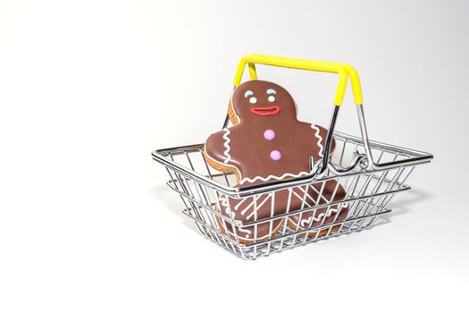 ginger cookies in the form of a man in a supermarket basket. High quality photo