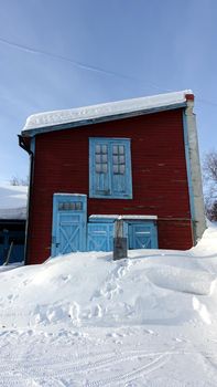 Historic building in the snowy center of Kiruna in northern Sweden during the winter