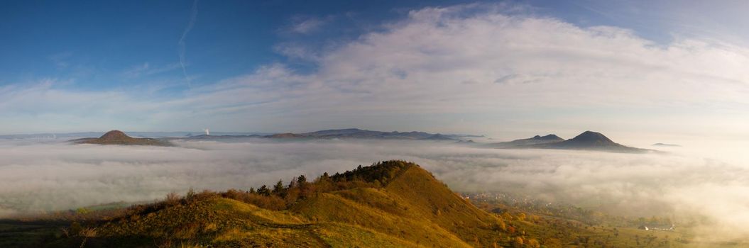 View from Rana hill.Misty morning in Central Bohemian Highlands, Czech Republic. Central Bohemian Uplands  is a mountain range located in northern Bohemia. The range is about 80 km long