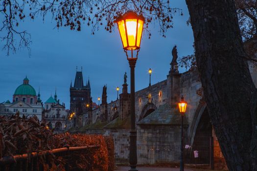 Evening scenery next to Charles bridge, Prague, Czech Republic. Twilight scenery. Popular European travel destination.