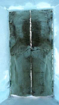 Jukkasjarvi, Sweden, February 27, 2020. one of the doors of the ice hotel covered with leather and reindeer horns