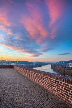View from the Vysehrad fort in the pink sunrise. Vysehrad is a historic fort located in the city of Prague. It was built probably in the 10th century.