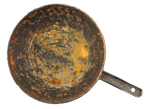old disgusting stained rusty cast iron pan with burnt fat and food leftovers isolated in directly above perspective.
